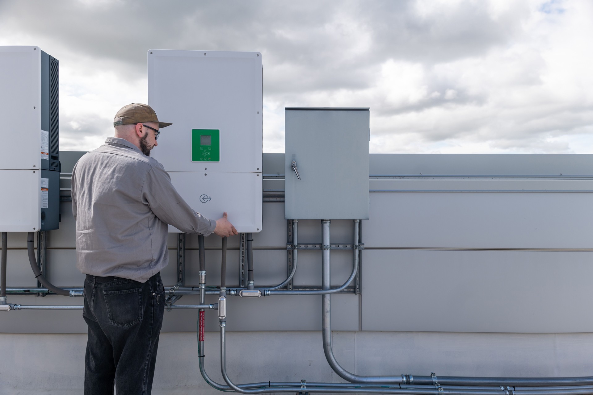 Certified technician working on home with solar panels